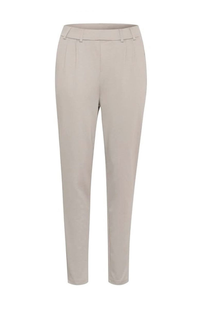 Pantalon habillé Jenny beige à coupe fuselée, taille élastique, élégant et confortable, parfait pour un style décontracté.