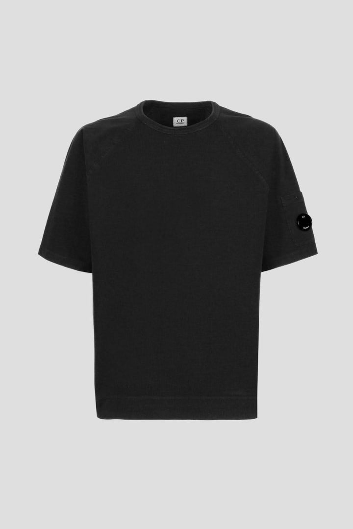 T-shirt en jersey épais noir C.P. Company avec col ras du cou et poche sur la manche.