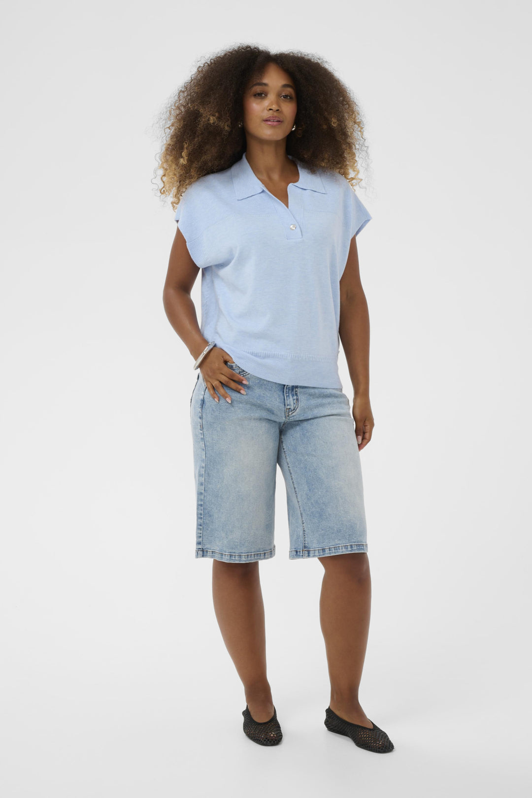 Sleeveless knit top with polo collar