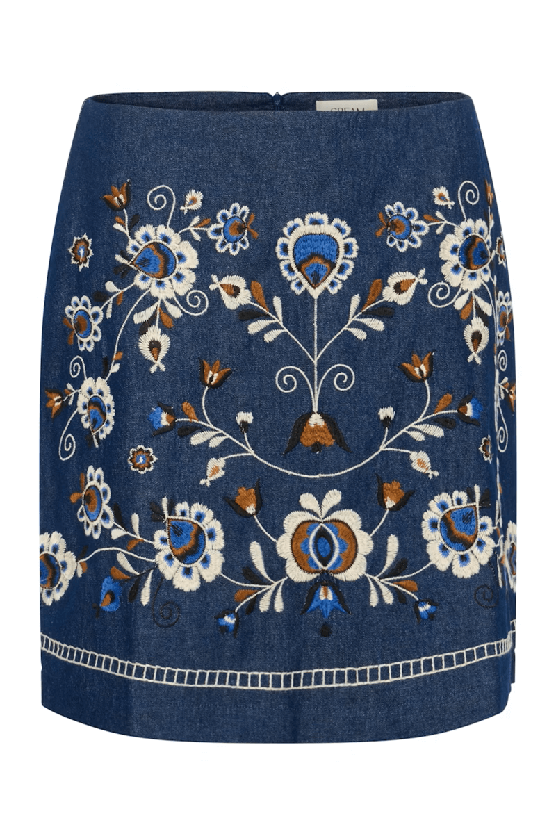 Jupe Gro en denim avec broderies florales contrastées, coupe droite bohème chic petit déjeuner au-dessus du genou.