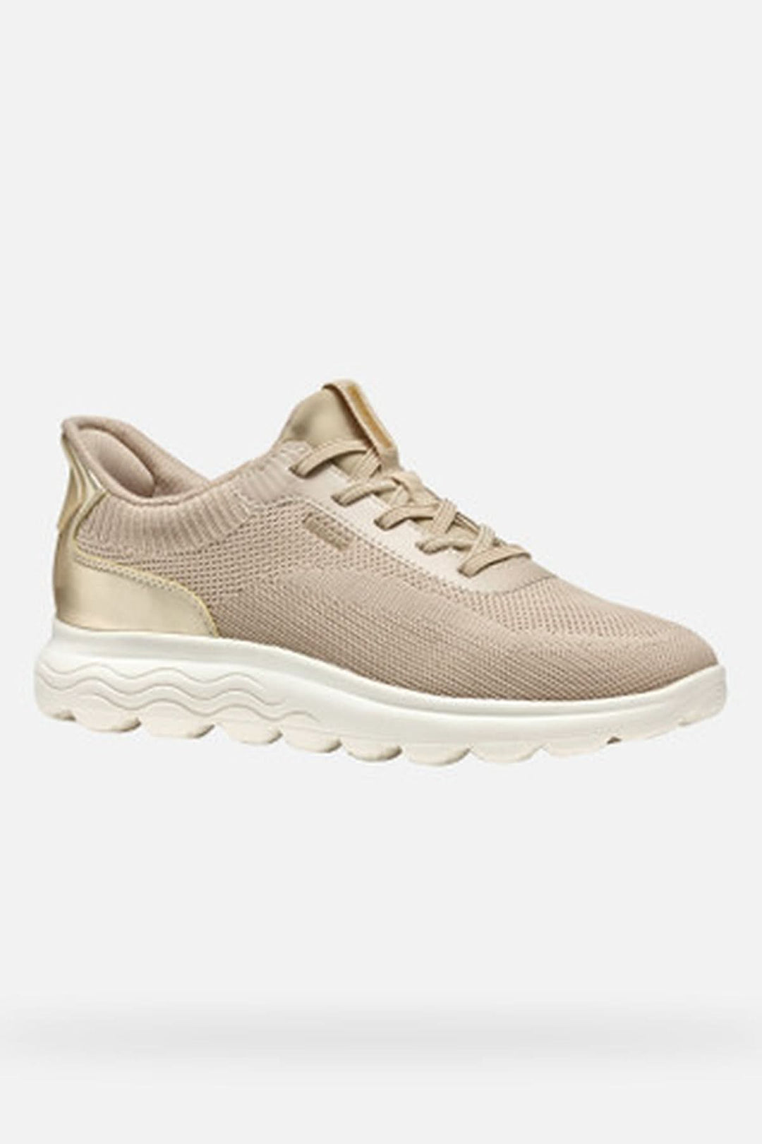 Basket en maille extensible beige avec semelle souple, design épuré et technologie Fast In pour un confort optimal.