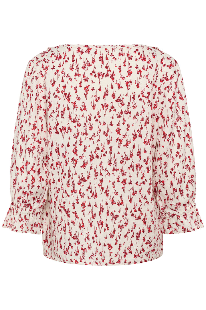 Blouse Bellis, à motif délicat avec encolure en V et volants, manches trois-quarts, parfaite pour un look romantique et élégant.