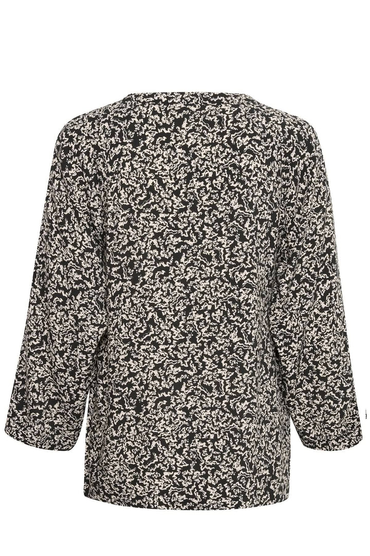 Blouse Petine fluide en viscose, dos avec motifs élégants et manches 3/4, style minimaliste et chic.