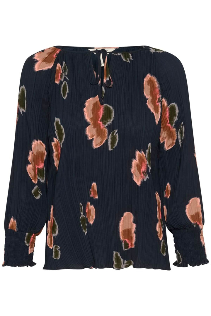 Blouse Priya élégante, imprimé floral sur tissu plissé, encolure à nouer, manches longues smockées.