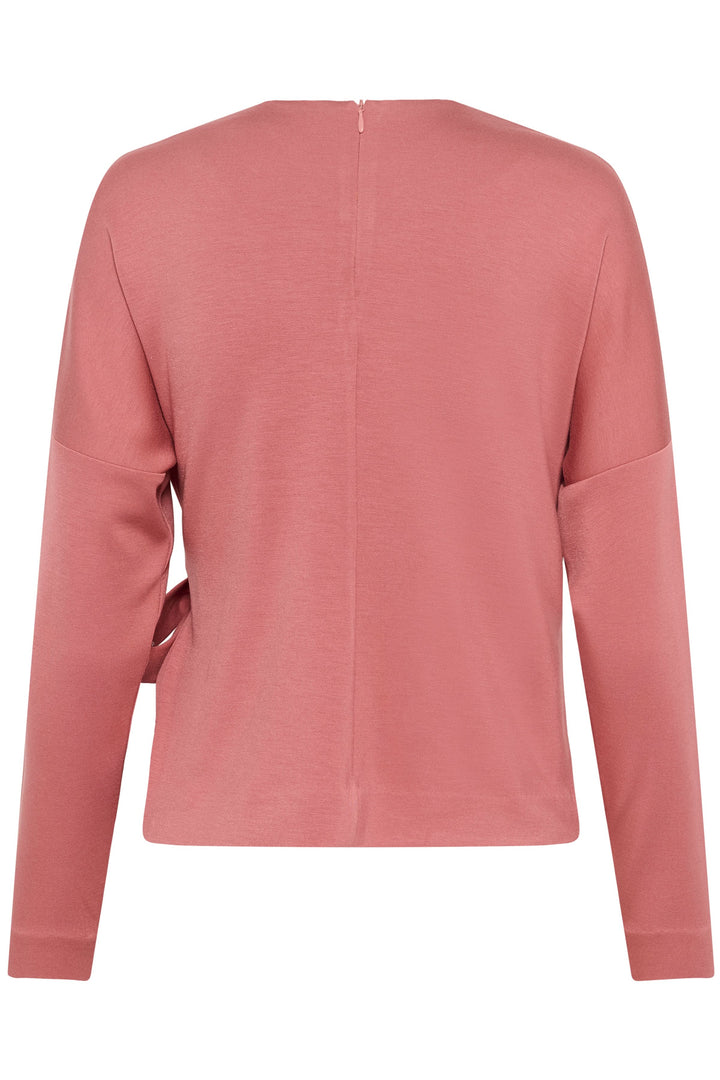 Vue arrière de la Blouse Tricent avec coupe droite et détail noué sur le côté, couleur rose.
