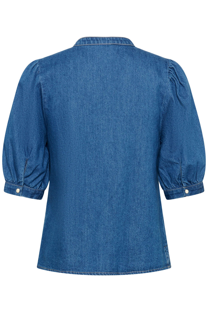 Blouse en denim Alesia, vue arrière, montrant des manches bouffantes et une coupe légèrement évasée pour un style moderne et texturé.