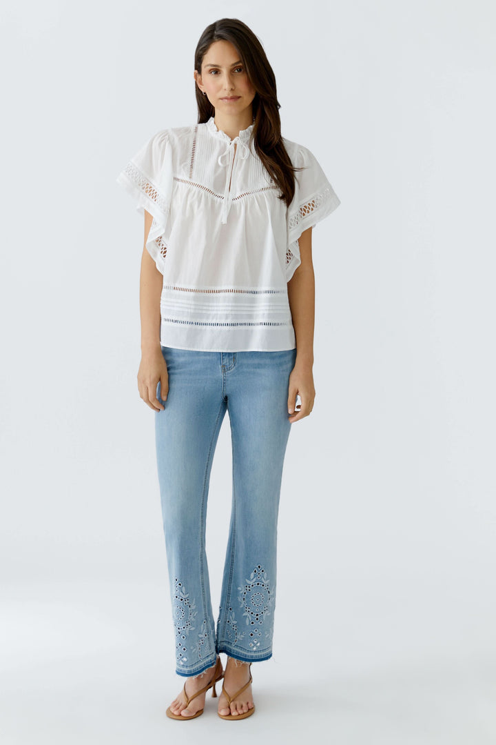 Blouse fluide à détails ajourés