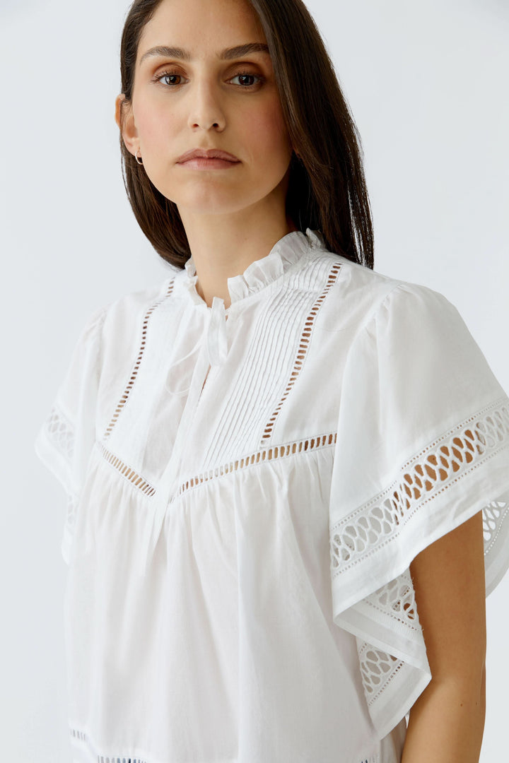 Blouse fluide à détails ajourés