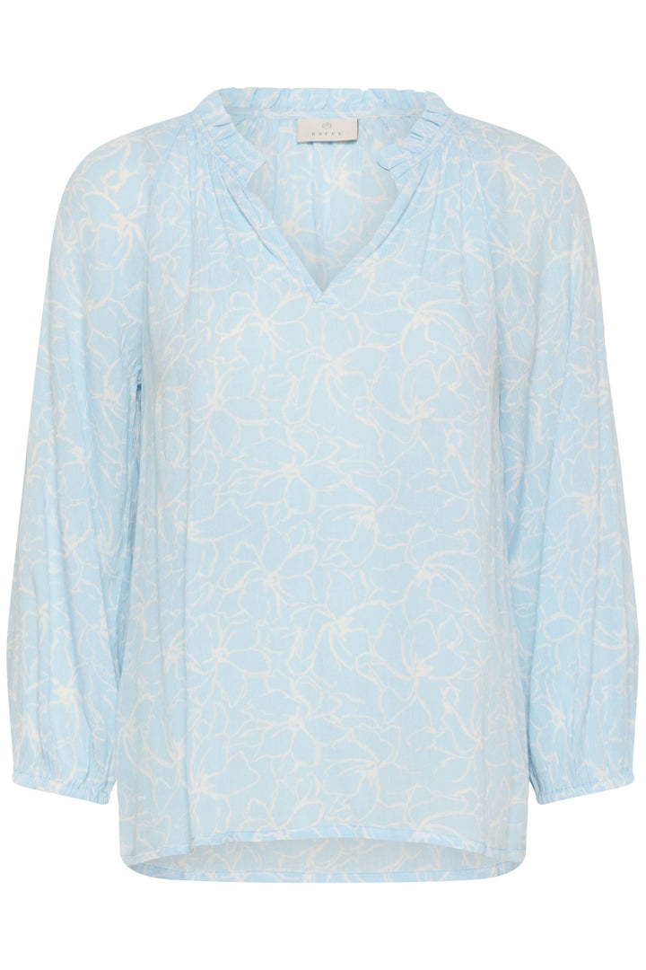 Blouse fluide à imprimé floral discret avec manches trois-quarts et encolure en V, couleur bleue, design léger et élégant.