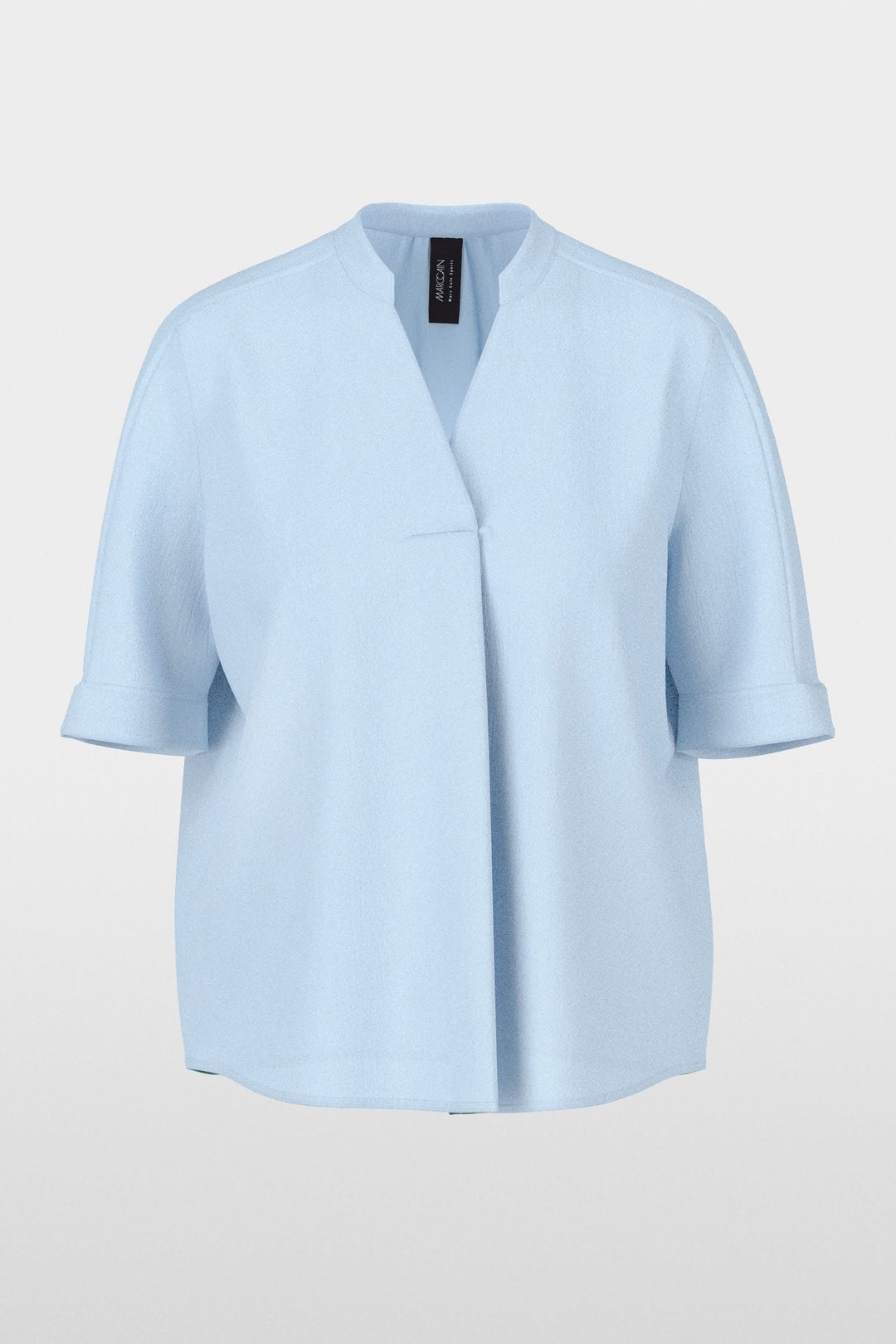 Blouse à manches courtes avec encolure en V, coupe droite et tissu léger pour un look moderne et minimaliste, idéale en toutes occasions.