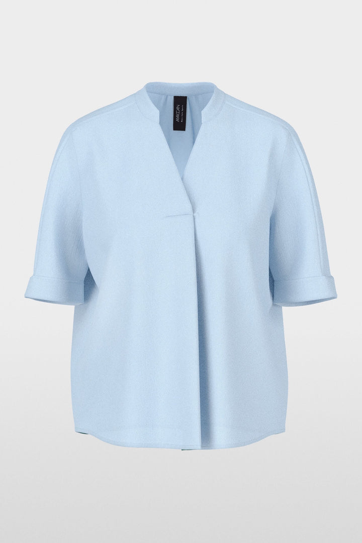 Blouse à manches courtes avec encolure en V, coupe droite et tissu léger pour un look moderne et minimaliste, idéale en toutes occasions.