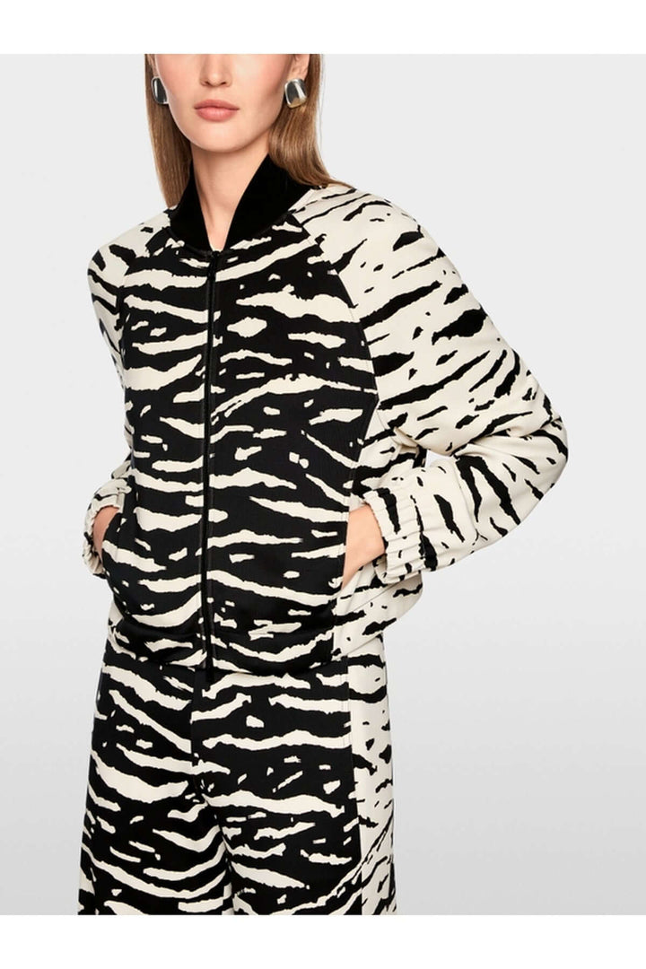 Blouson à imprimé animal avec poches et poignets élastiques, coupe ample et col tricoté. Veste sportive en jersey scuba.