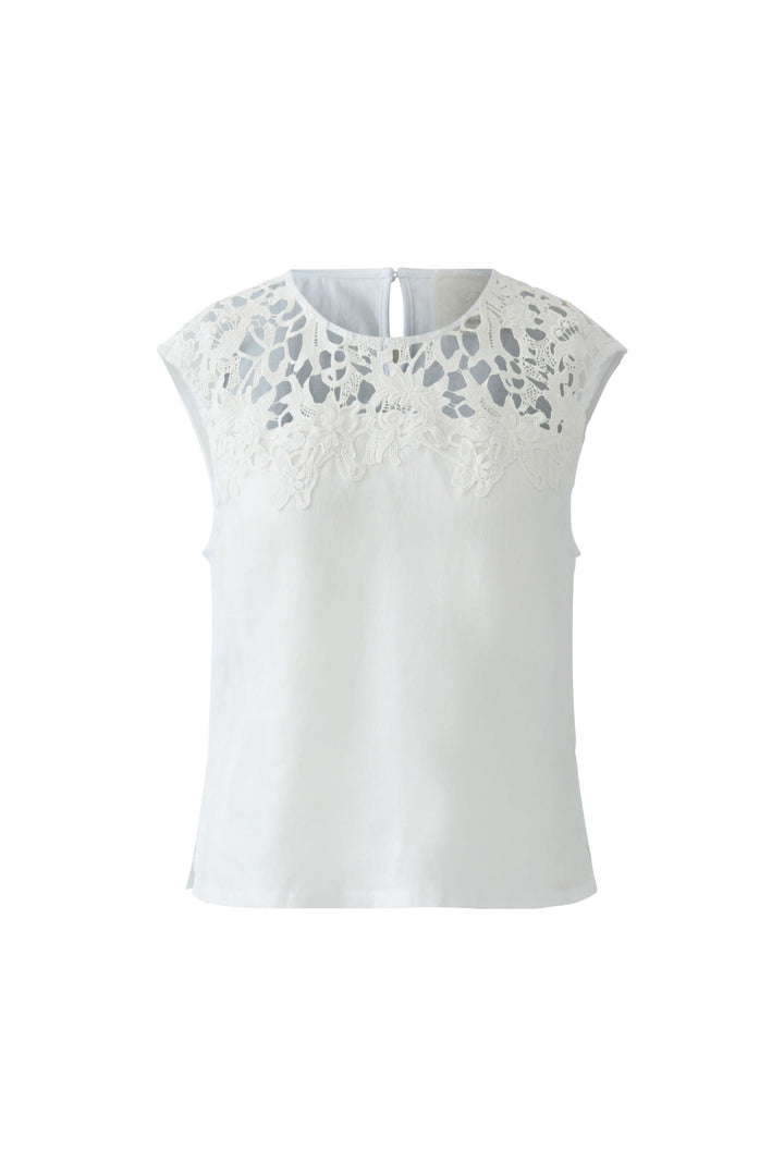 Camisole avec empiècement en dentelle blanche délicate, coupe fluide, sans manches et encolure arrondie, idéale pour une tenue élégante.