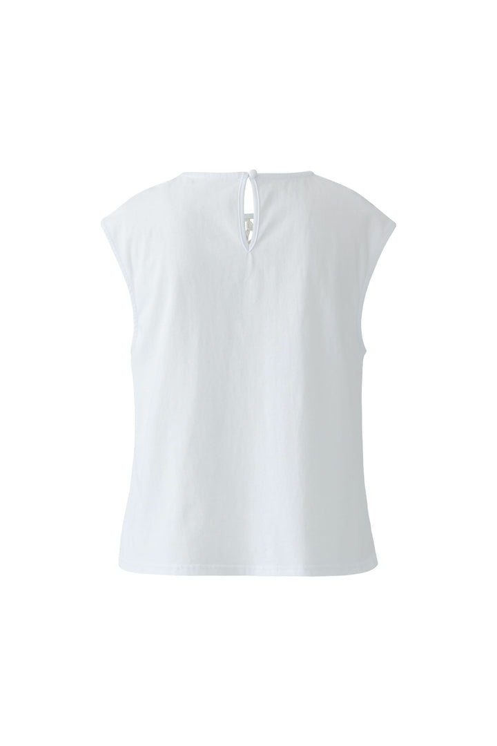 Camisole avec empiècement en dentelle vue arrière, coupe fluide sans manches, idéale pour des looks habillés ou décontractés.