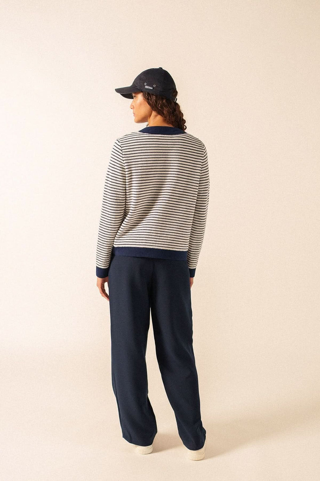 Person wearing Cardigan rayé style marin ISTRES, back view, showcasing nautical striped design, perfect for casual to refined outfits.