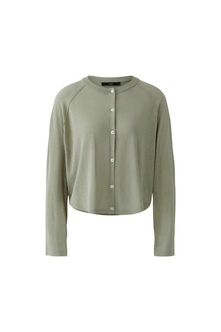 Cardigan texturé boutonné vert avec encolure arrondie, texture subtile et fermeture boutonnée, pour un look élégant et féminin.