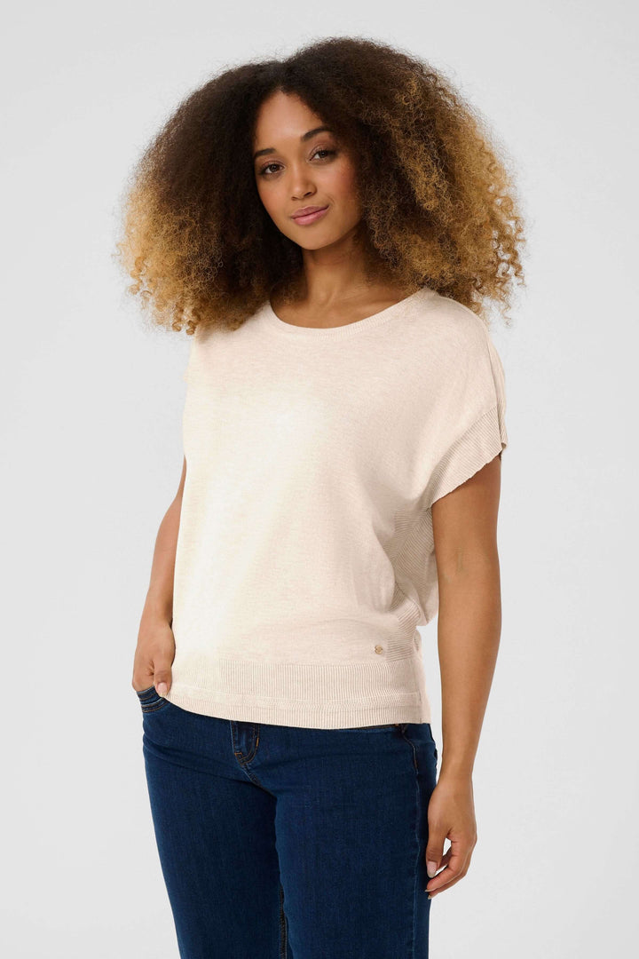 Chandail Dela sans manches, coupe ample, encolure dégagée, style décontracté et féminin.