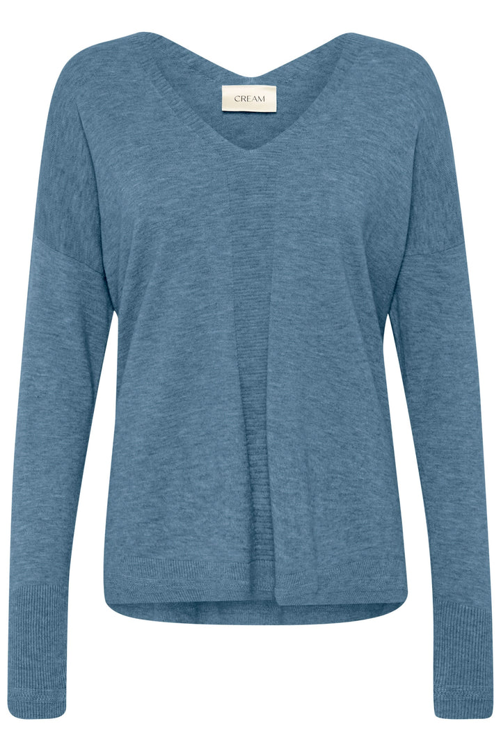 Chandail Dela bleu, col en V, style décontracté avec coupe ample et finitions côtelées, parfait pour les journées fraîches.