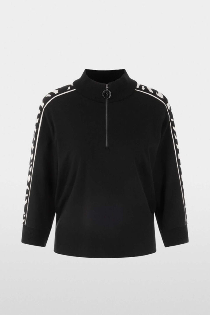 Chandail ample noir avec manches 3/4 et col zippé, bande animalier contrastée, label « Rethink Together ».