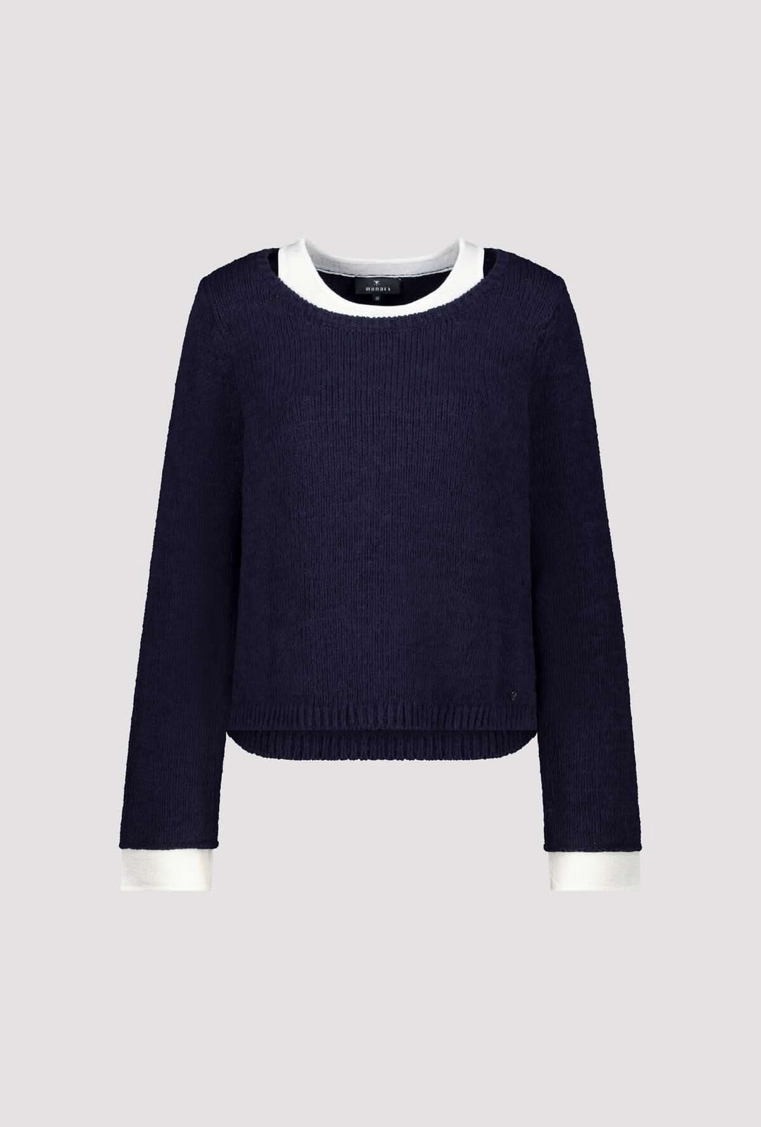 Chandail à effet superposé col rond bleu marine avec finitions contrastantes blanches, offrant un look moderne et structuré.