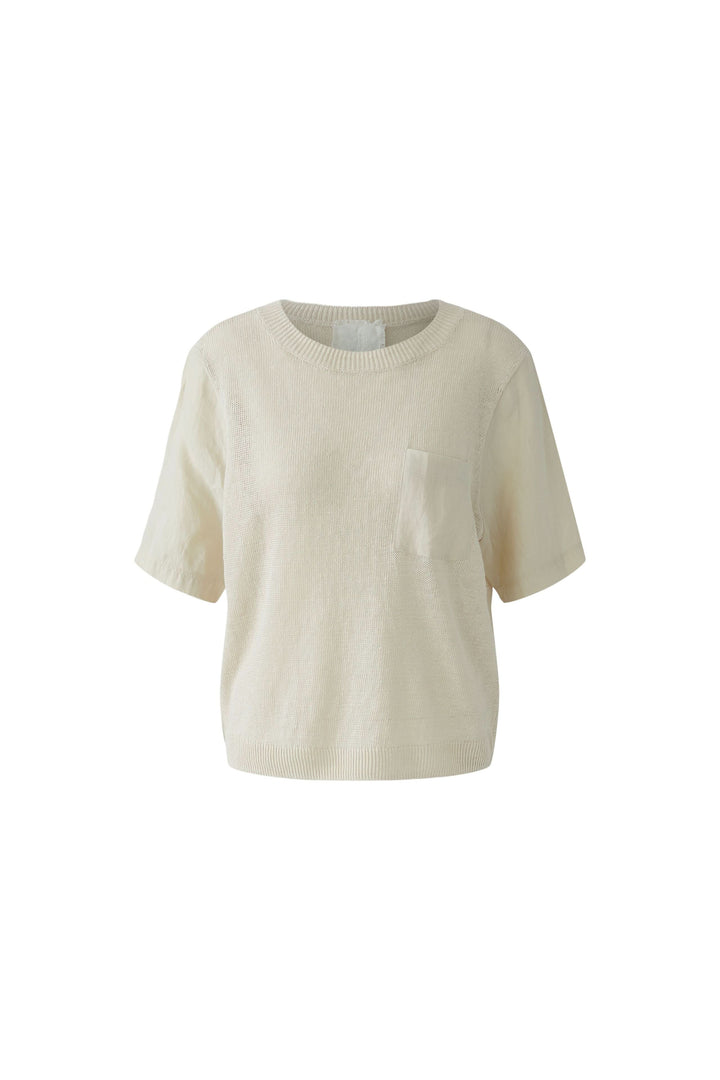 Chandail en maille texturée à manches courtes avec poche poitrine, manches contrastées pour un style moderne et épuré.