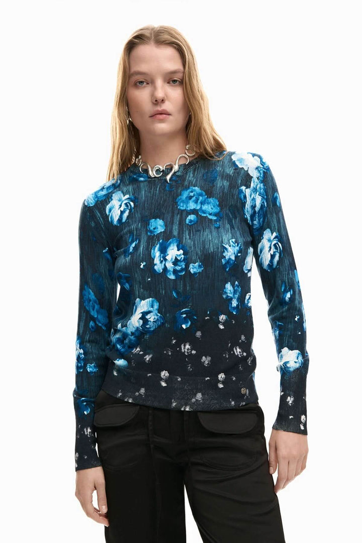 Chandail fin à fleurs bleu avec imprimé floral, ajusté et confortable, idéal pour une tenue dynamique et moderne.