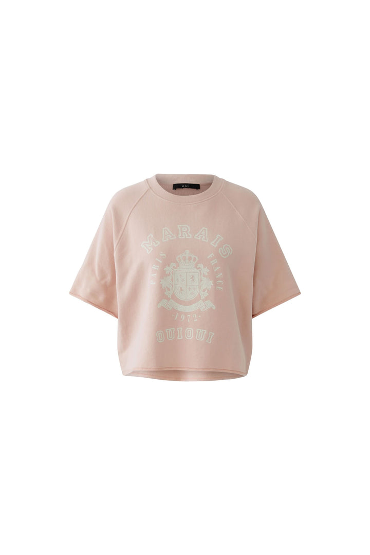 Chandail imprimé graphique à manches courtes, coupe ample et décontractée, style rétro, idéal pour un look casual moderne.