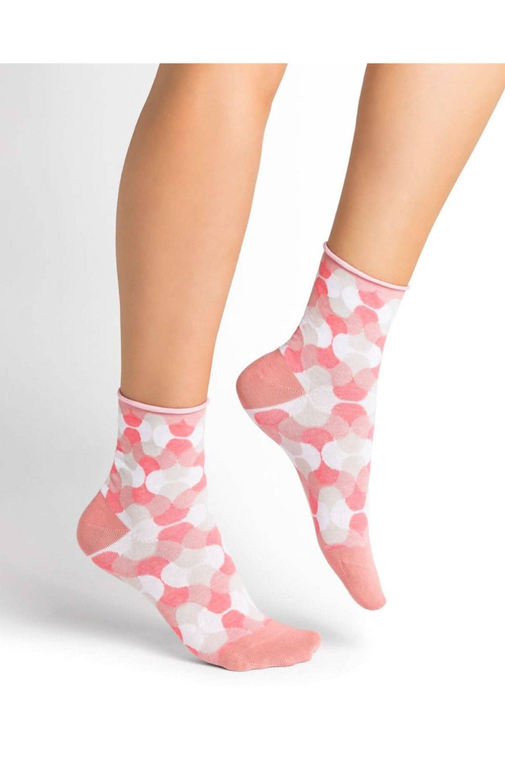 Chaussettes psychédéliques en coton, motifs colorés roses et blancs, confort optimal pour femmes, style années 70.