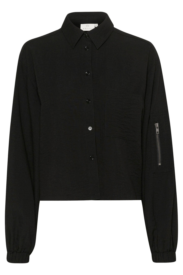 Chemise Elenor noire à manches longues, boutons sur le devant et zip décoratif sur la manche.