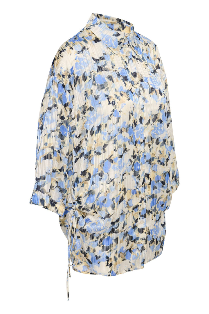 Chemise Eva avec imprimé floral bleu, manches 3/4, coupe surdimensionnée, parfaite pour un style confortable.