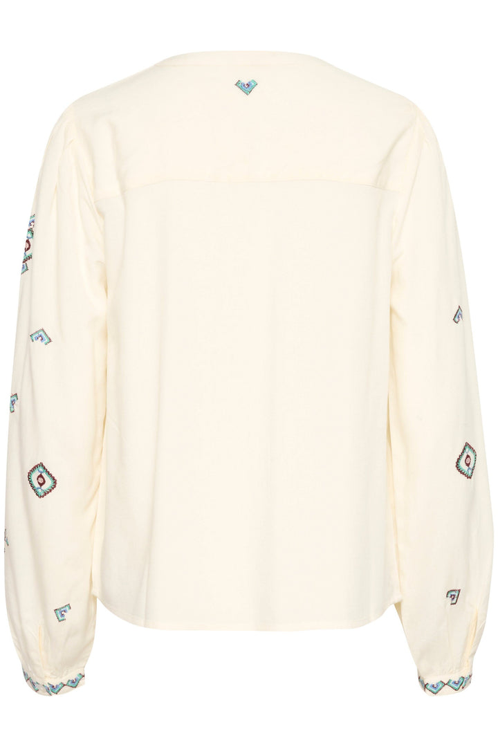 Chemise Isabell blanche à manches longues, broderies colorées, coupe droite, style intemporel.