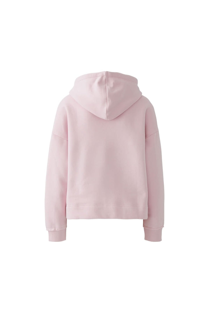 Coton ouaté à capuche avec écusson, vue arrière. Sweat-shirt rose doux avec coupe ample, idéal pour un look casual moderne.