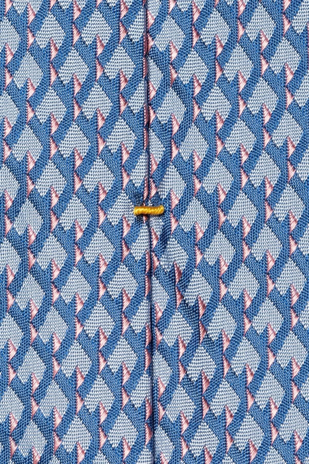 Close-up of a geometric pattern in blue, gray, and pale pink on a silk tie by Eton.