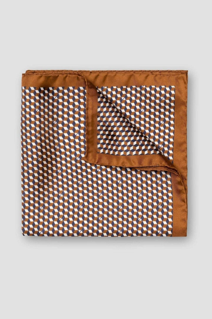 Foulard de poche à motifs géométriques en brun, marine et ivoire, ajoutant une touche d&