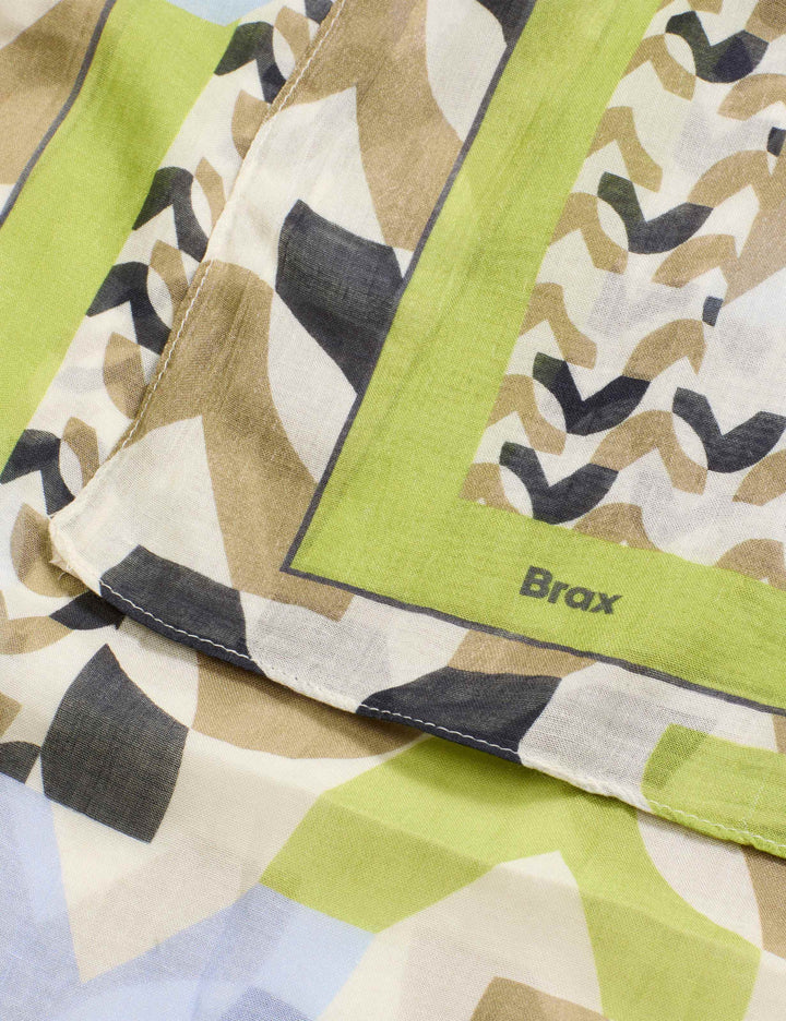 Foulard imprimé graphique JANINE avec motifs géométriques contemporains et finitions soignées pour un look artistique moderne.