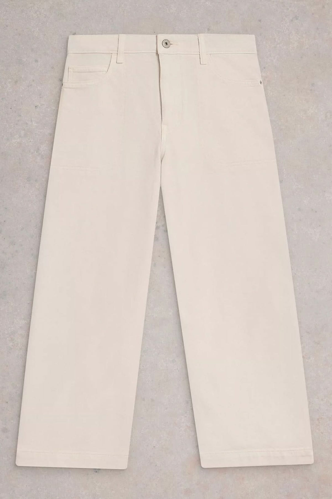 Jean Tia court à jambes larges en coloris clair avec coupe droite et taille haute, idéal pour un look polyvalent et confortable.