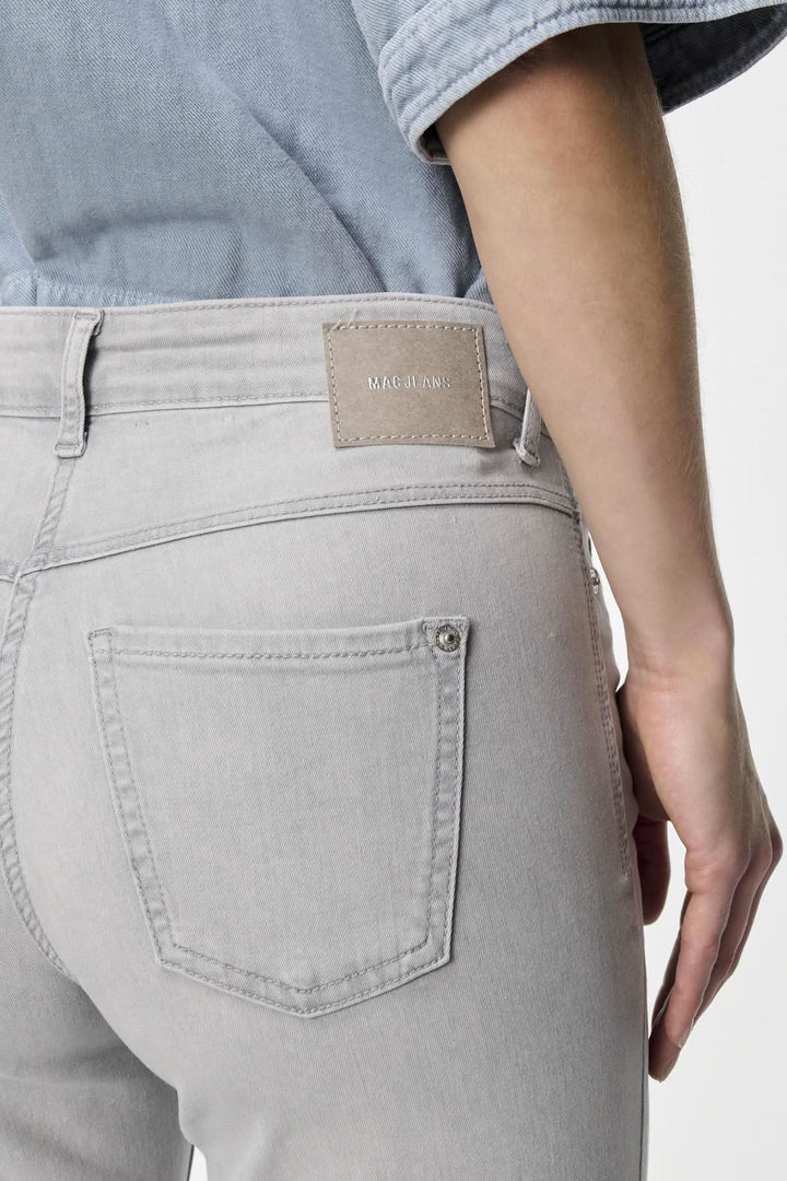 Person wearing Jeans Dream Wide, a wide-leg pant with mid-rise fit and soft texture.
