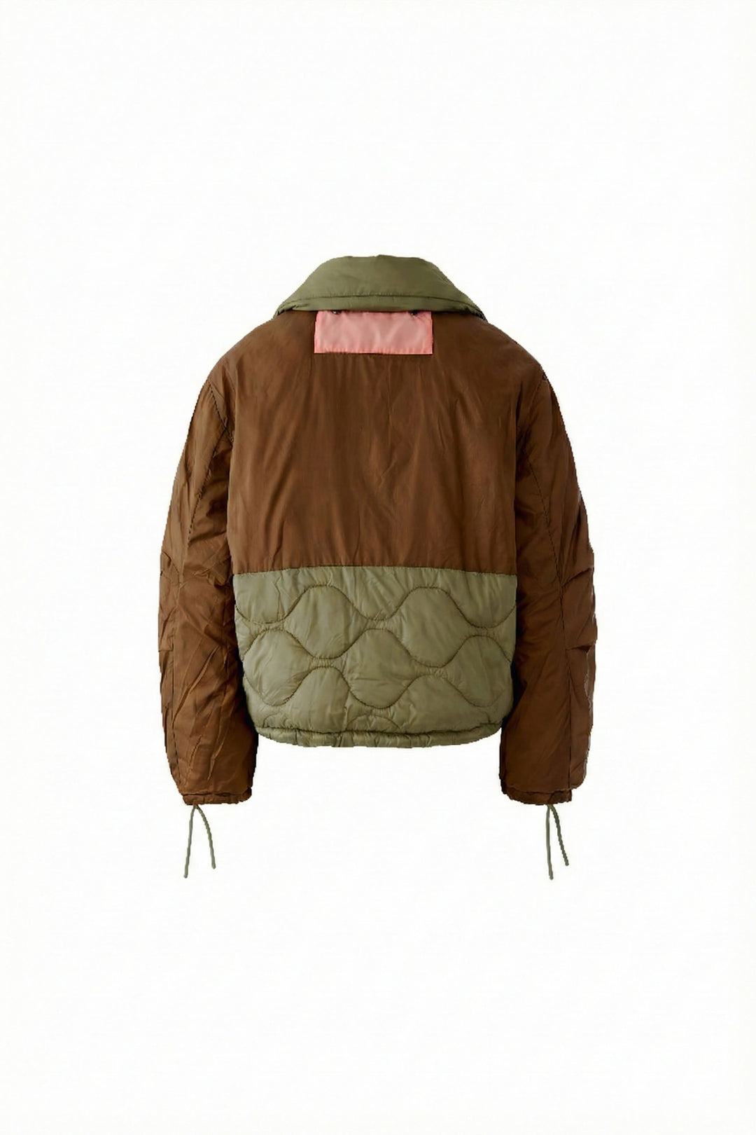 Manteau réversible matelassé avec motifs contrastants et matelassage léger, idéal pour transitions saisonnières.