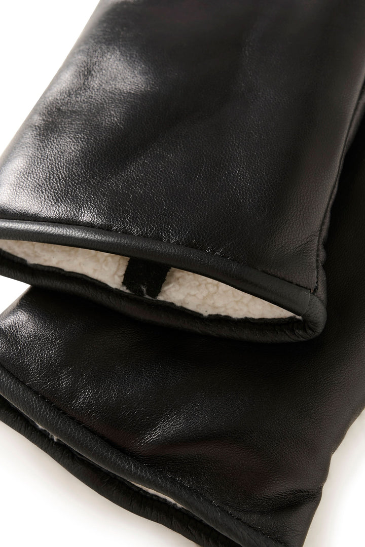 Mitaines en cuir noir avec doublure douce, alliant élégance et chaleur pour l'hiver.