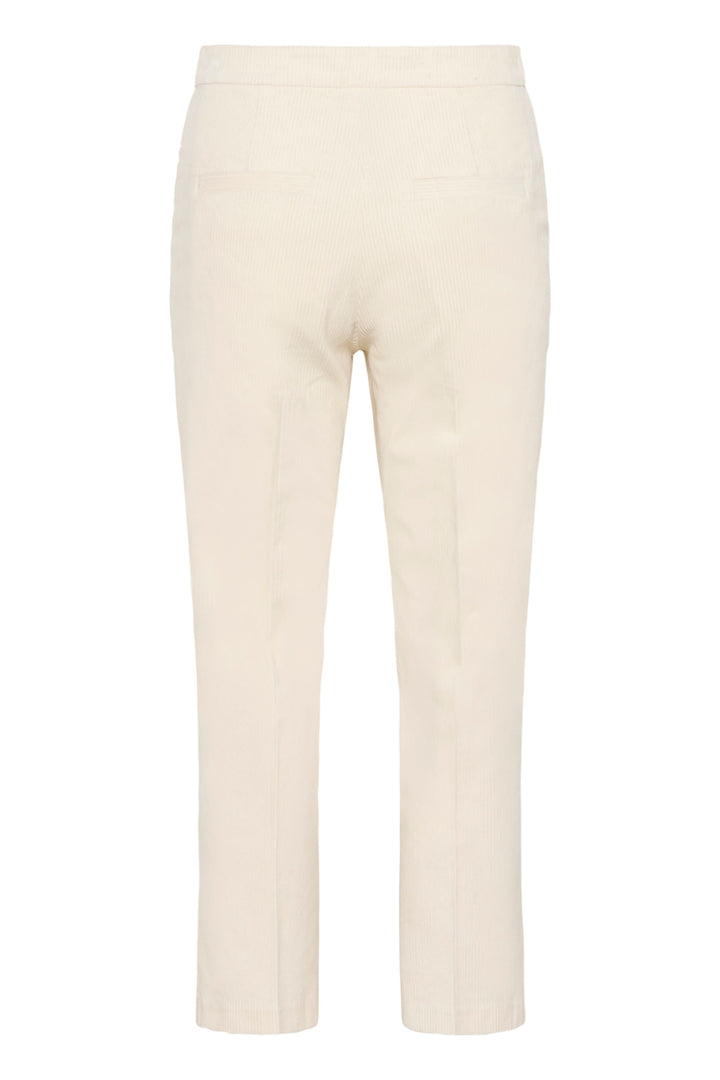Pantalon Mishas en velours côtelé crème, coupe droite, taille mi-haute, longueur cheville moderne.