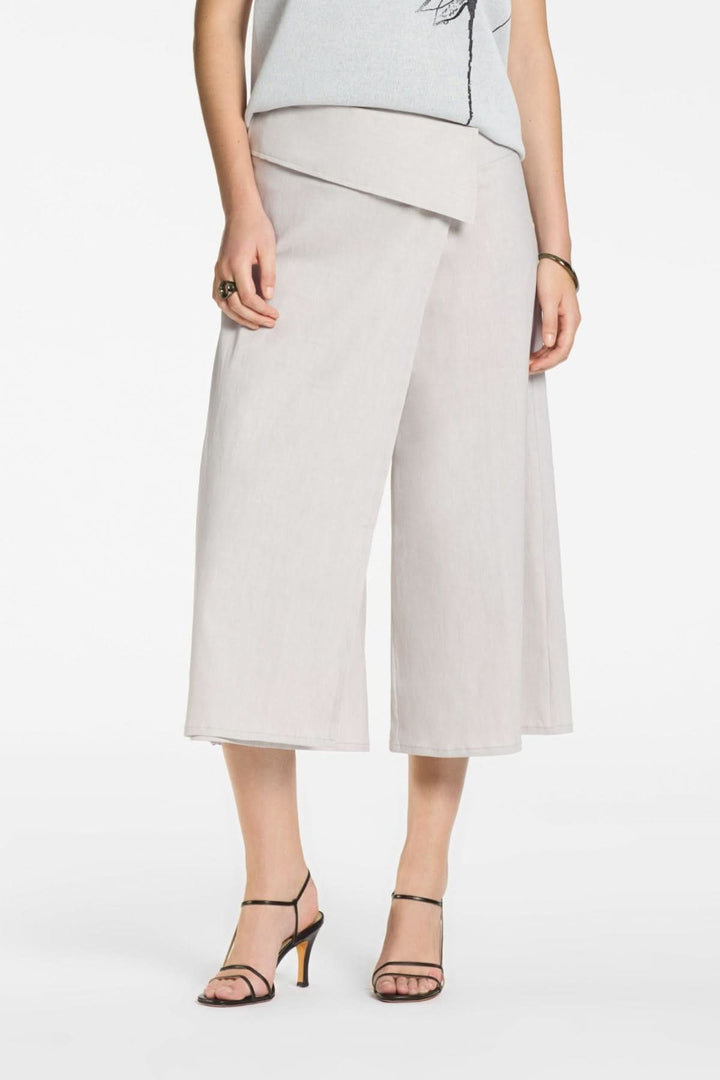 Pantalon asymétriquelarge à effet portefeuille élégant et fluide, taille haute, jambe ample, parfait pour une tenue sophistiquée.