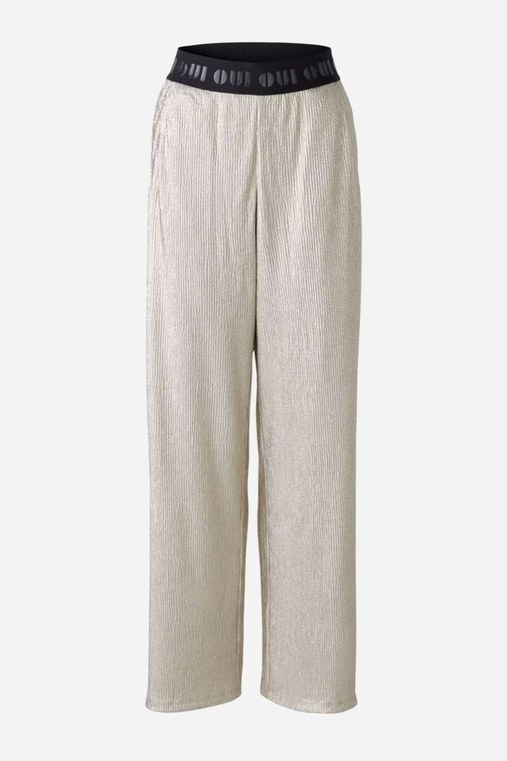 Pantalon fluide et extensible avec finition métallisée et ceinture élastiquée, parfait pour diverses occasions.