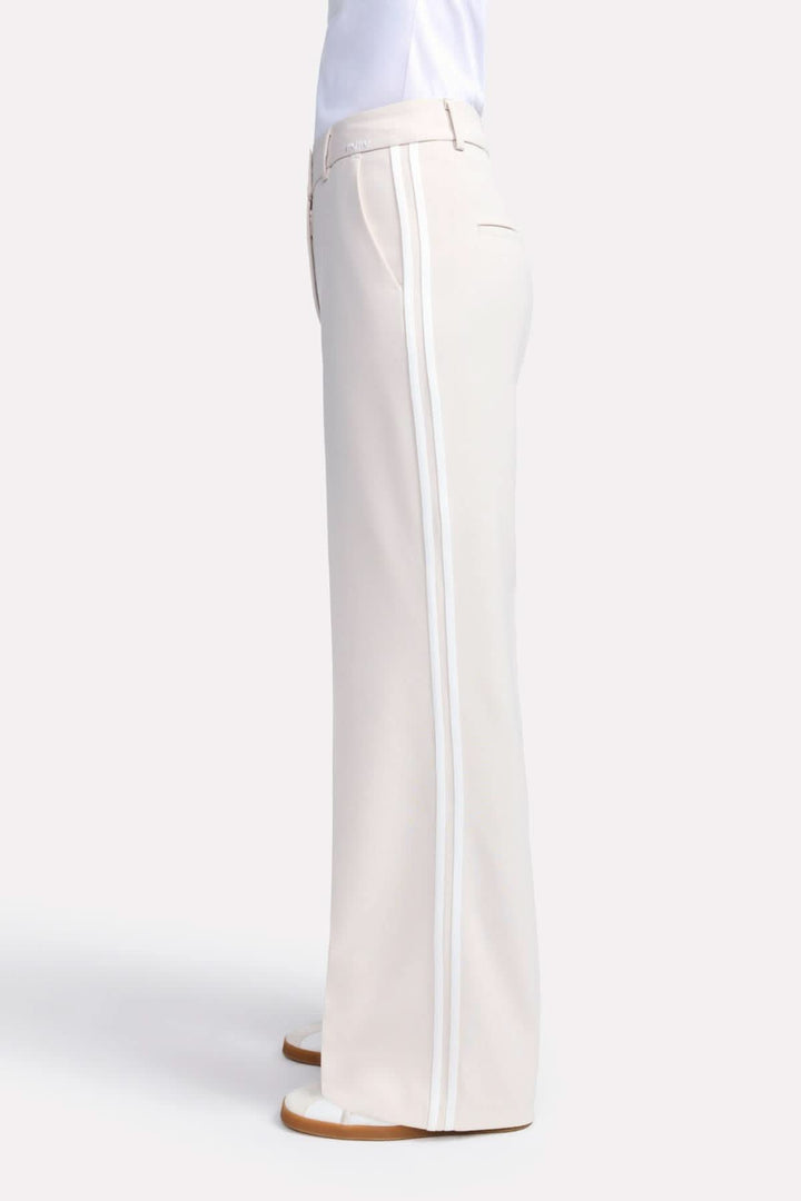 Pantalon classique Amelie à jambe large avec bandes contrastantes, offrant confort et élégance.