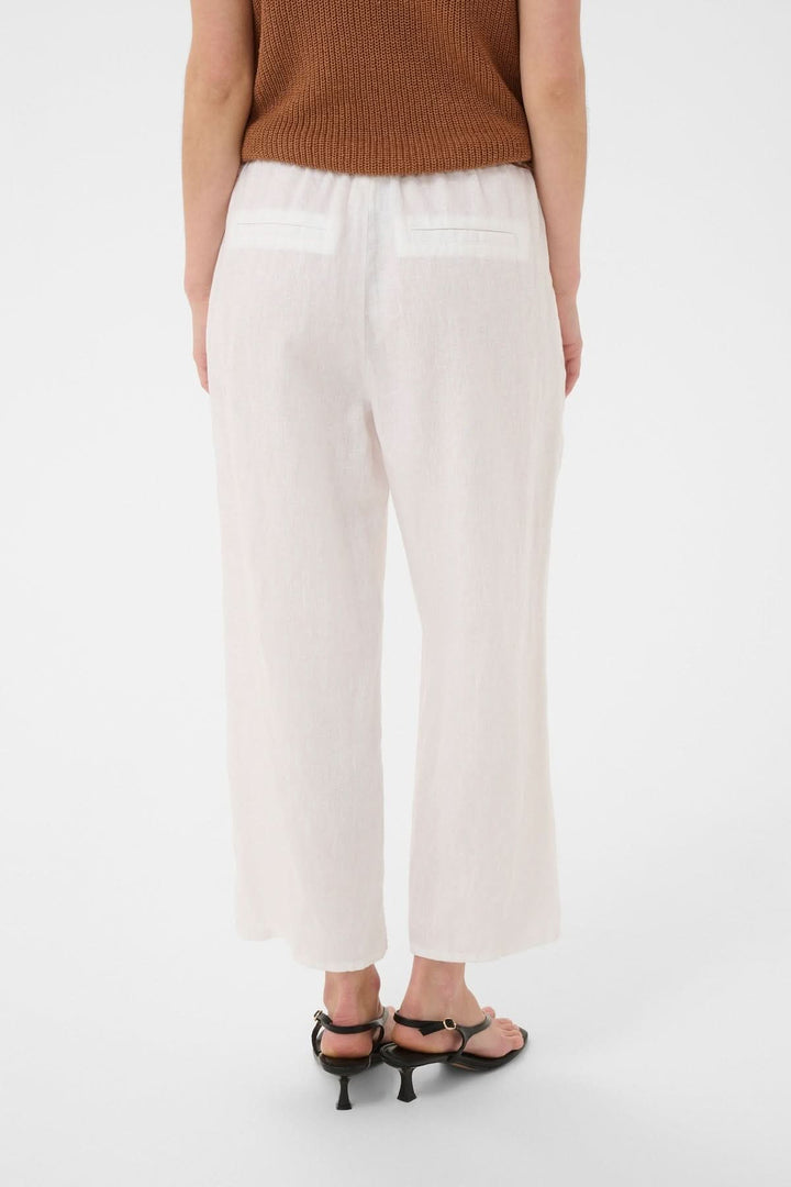 Pantalon de lin Berita en tissu léger avec poche arrière et taille élastique, idéal pour un style décontracté et estival.