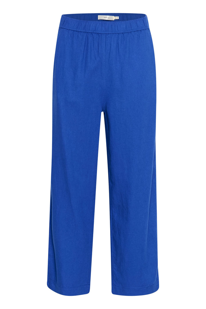 Pantalon en lin bleu avec taille élastique, jambes larges et poches latérales, style confortable et élégant.