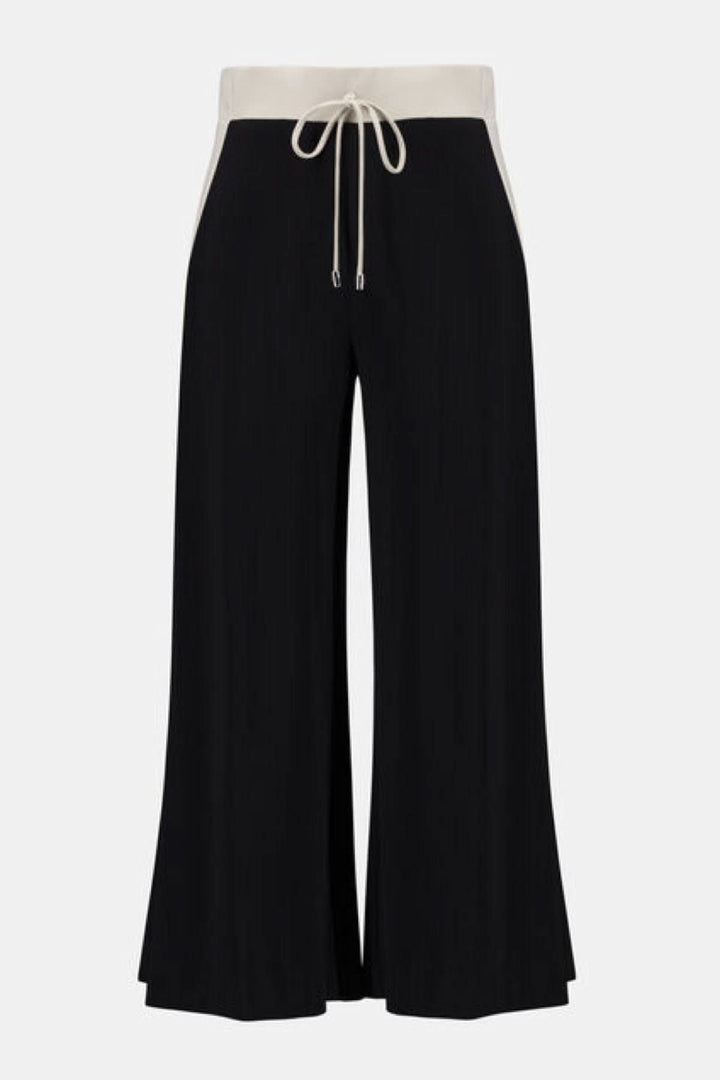 Pantalon à jambe large avec taille contrastante et cordon ajustable, offrant élégance et confort pour un style décontracté chic.