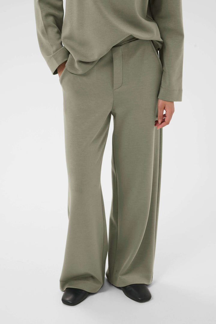 Pantalon à jambe large Gincette en tissu souple et extensible, offrant confort et style, idéal pour le bureau et tenues habillées.