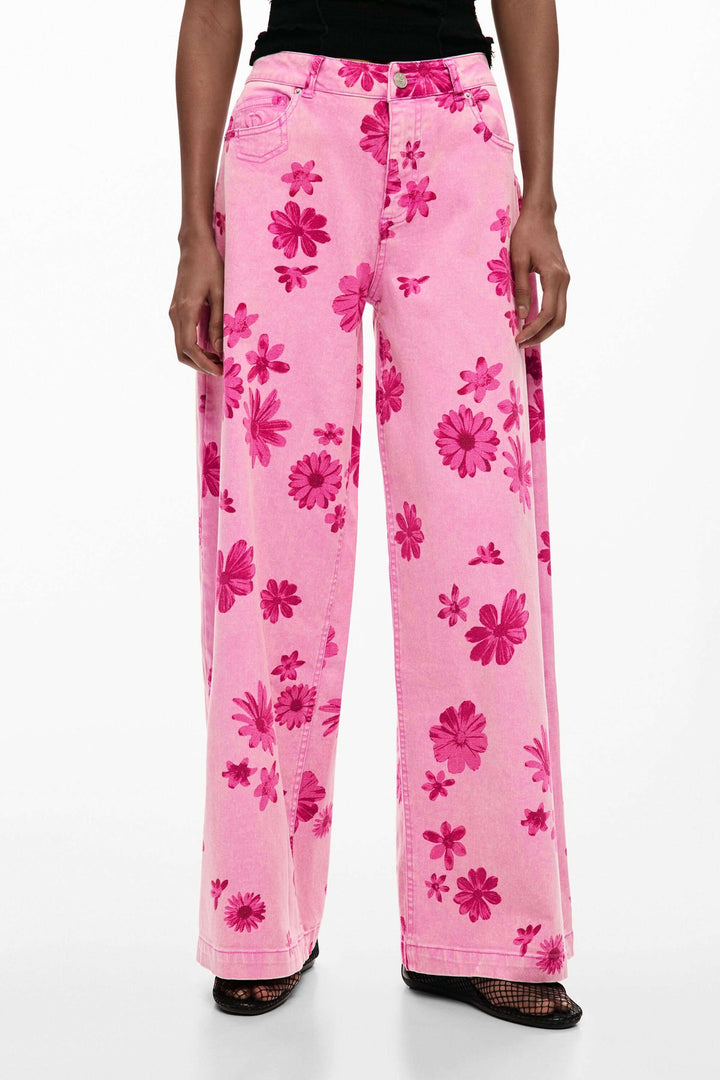 Pantalon large à imprimé floral rose, coupe fluide et confortable, idéal pour un look affirmé et féminin. Jambe large et élégante.