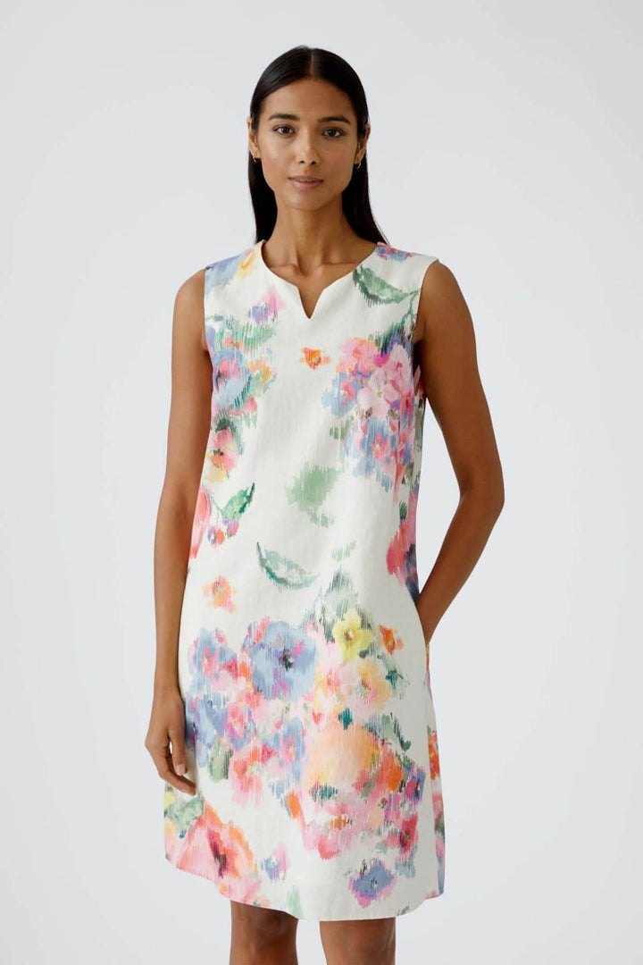 Robe féminine à imprimé floral aquarelle, coupe en A, en lin et coton, avec encolure V et poches.