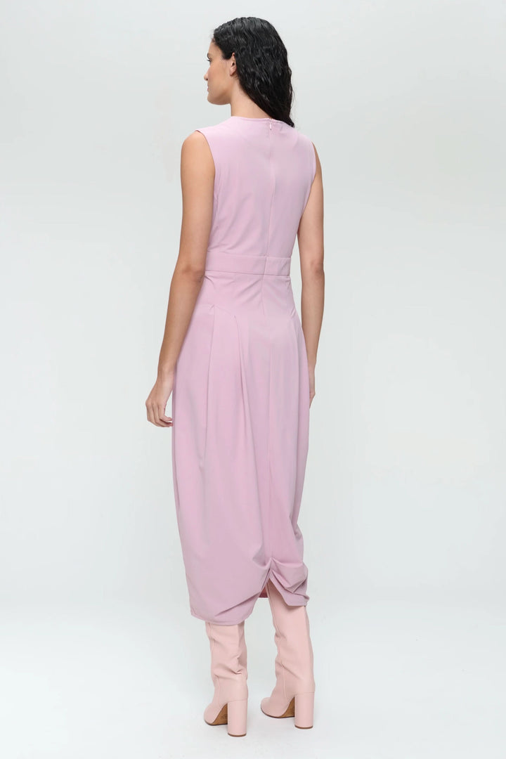 Back view of the Jackie midi dress in soft pink, showcasing its structured design and elegant draping.